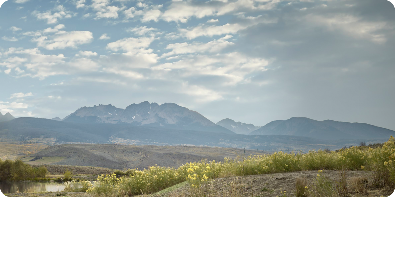 A Landscape View of the Mountains Under a Beautiful Blue Sky