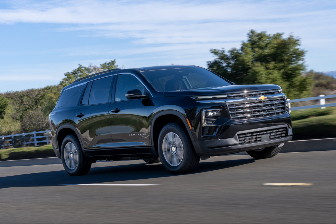 A 2027 Chevy Traverse Driving on a Highway Showcasing a Strong Side Profile and Modern Exterior Styling.