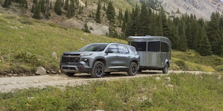 A 2027 Chevy Traverse Parked With a Trailer Attached in an Outdoor Setting.