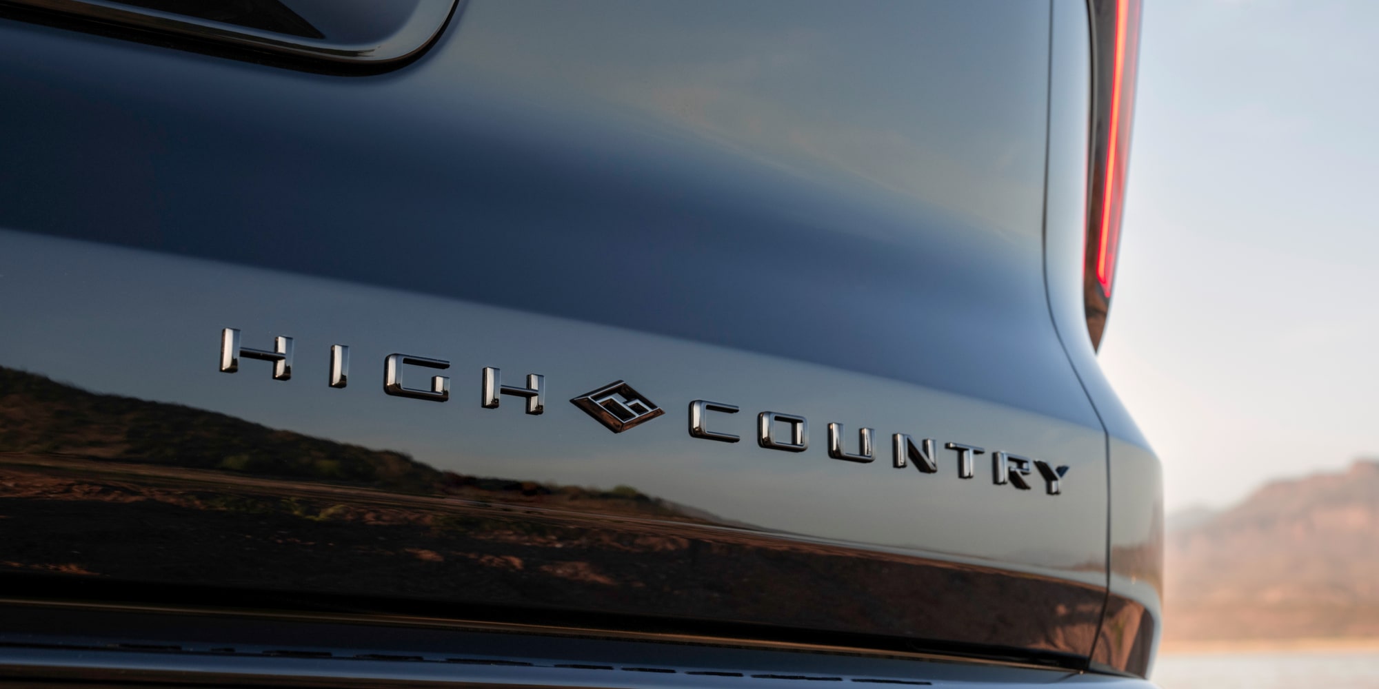 Close-up of the 2027 Chevy Traverse Trim Plate Reading "High Country" on the Exterior of the Vehicle