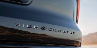 Close-up of the 2027 Chevy Traverse Trim Plate Reading "High Country" on the Exterior of the Vehicle