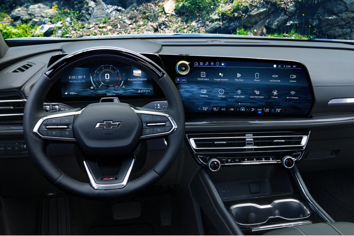 The Interior of a 2027 Chevy Traverse Featuring a Digital Driver Display, Infotainment Touchscreen, and Multifunction Steering Wheel.