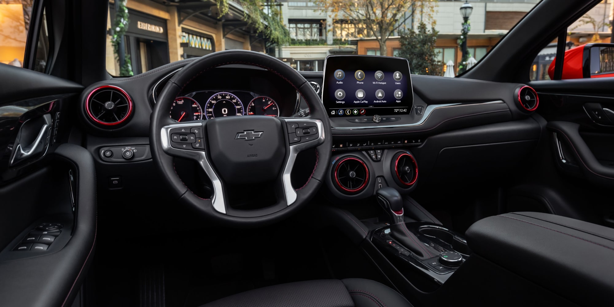 The Chevy Blazer's Front Interior Row and Dashboard in Black with Red Accent Stitching
