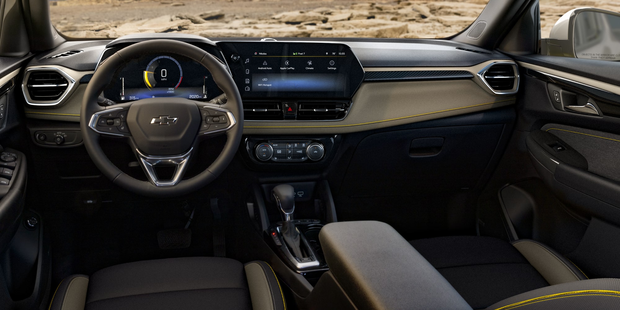 The Chevy Trailblazer's Front Interior Row and Dashboard in Gray and Black in a Yellow Accent Stitching