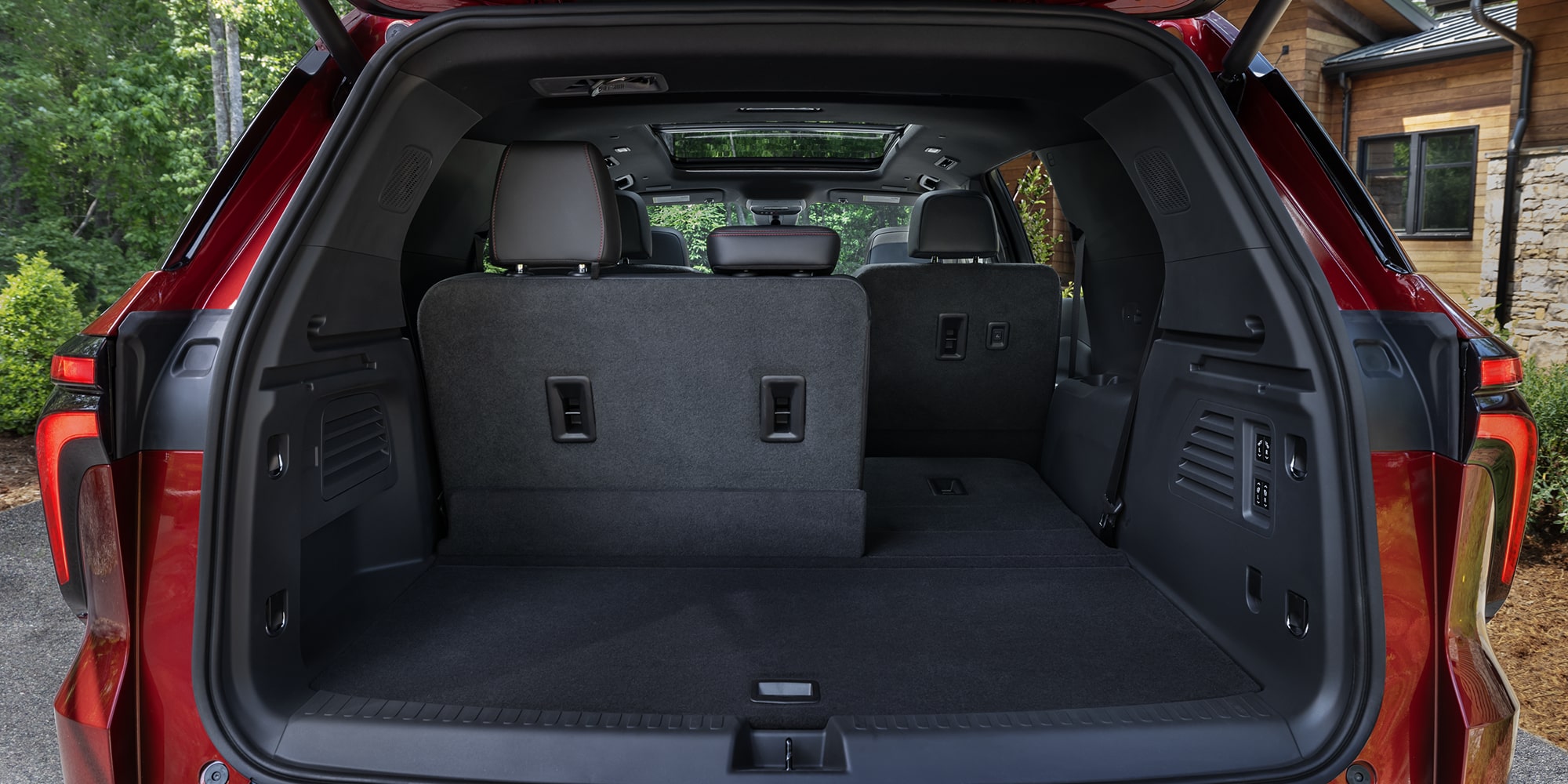The Cargo Area of a Chevy Traverse Showing an Open Rear Hatch With Spacious Storage and Foldable Rear Seats.