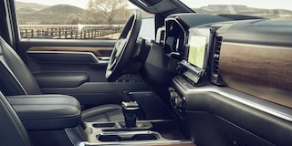 Interior of a 2026 Chevy Silverado LD Featuring a Large Touchscreen Display Wood Trim Accents and Modern Controls