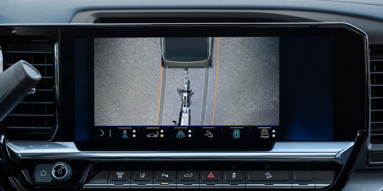 The Rearview Camera Display Inside a Chevy Silverado LD Showing a Hitch View for Trailer Alignment on the Dashboard Screen.