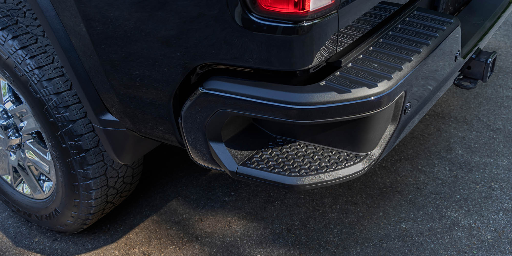 Rear bumper corner step and wheel of a 2026 Chevrolet Silverado HD