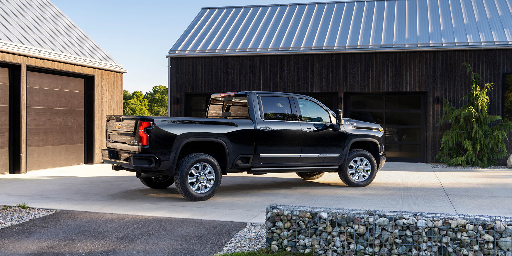 Side view of a black 2026 Chevrolet Silverado HD High Country pickup