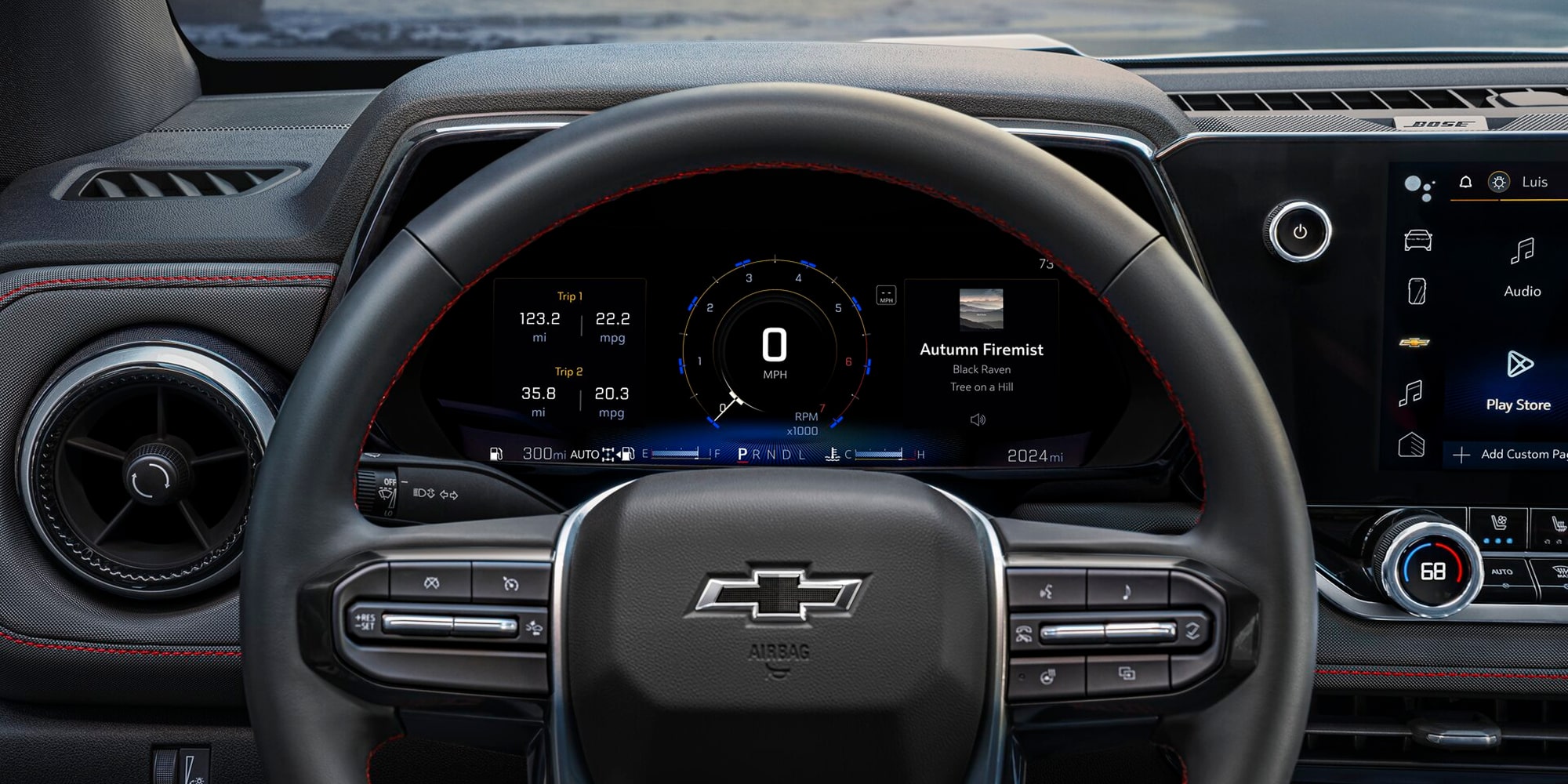 Steering Wheel, Digital Driver Display, and Dashboard Controls of a Chevy Colorado Interior.