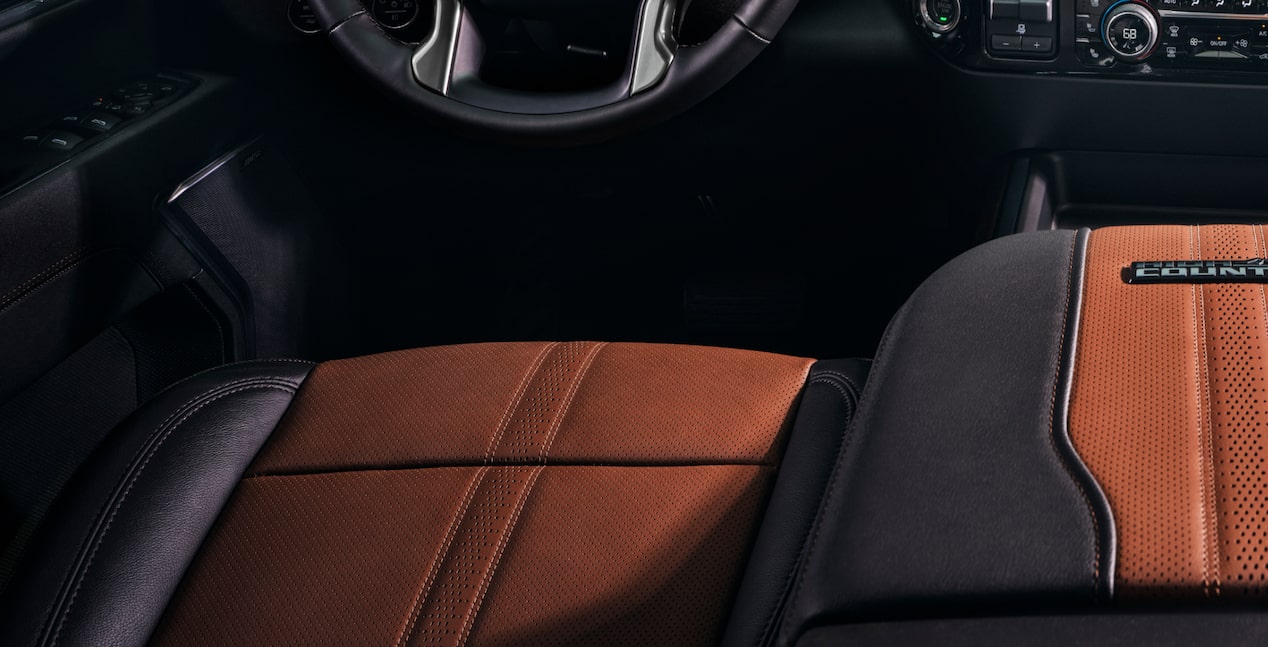 A Close-Up View of the Premium Interior Seating in a Chevy Silverado HD Featuring Two-Tone Leather Upholstery With Contrasting Stitching and Perforated Seat Surfaces
