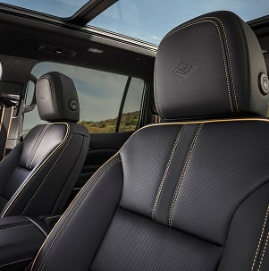 Premium Black Leather Front Seats in the Chevrolet Traverse High Country Featuring High Country Embossed Headrests, Contrast Stitching, and a Panoramic Sunroof.