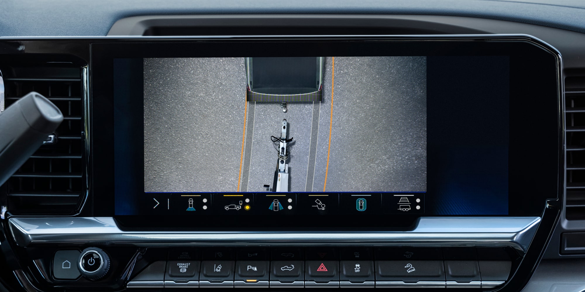 The Rearview Camera Display Inside a Chevy Silverado LD Showing a Hitch View for Trailer Alignment on the Dashboard Screen.