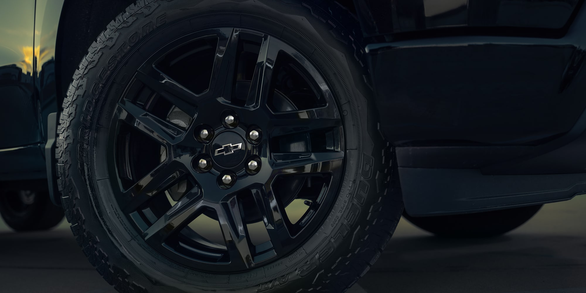 Close-up View of the Tire and Black Rim on a Chevy Silverado 1500 Truck.