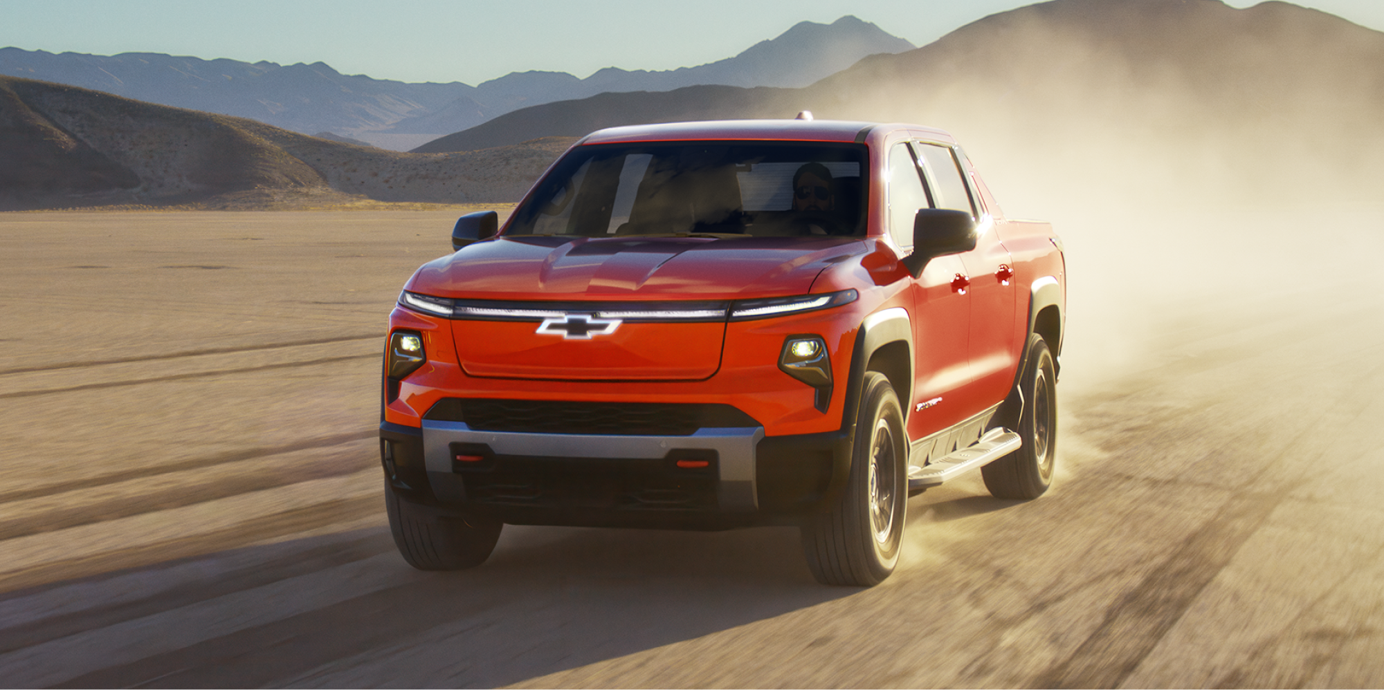 Silverado EV Trail Boss Speeding on Dusty Terrain