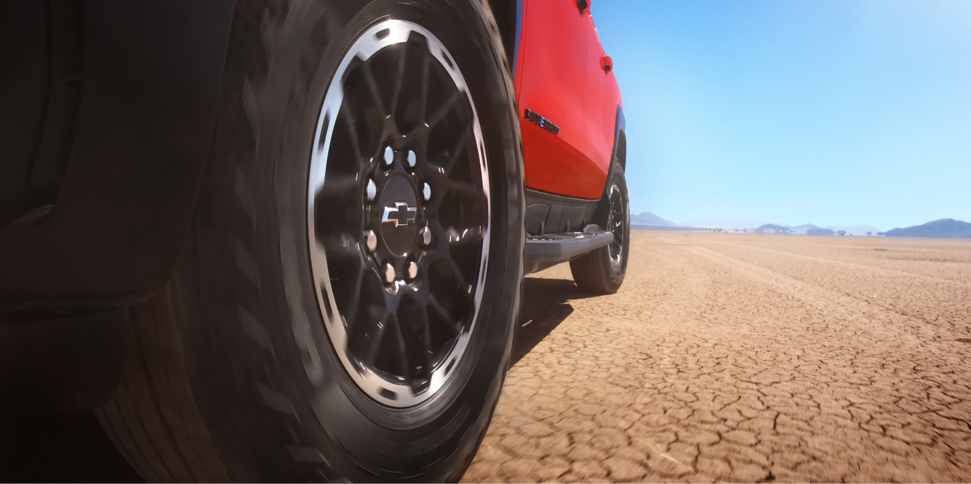 Close-Up View of the Wheels Driving Off Road on a Trail Boss Truck
