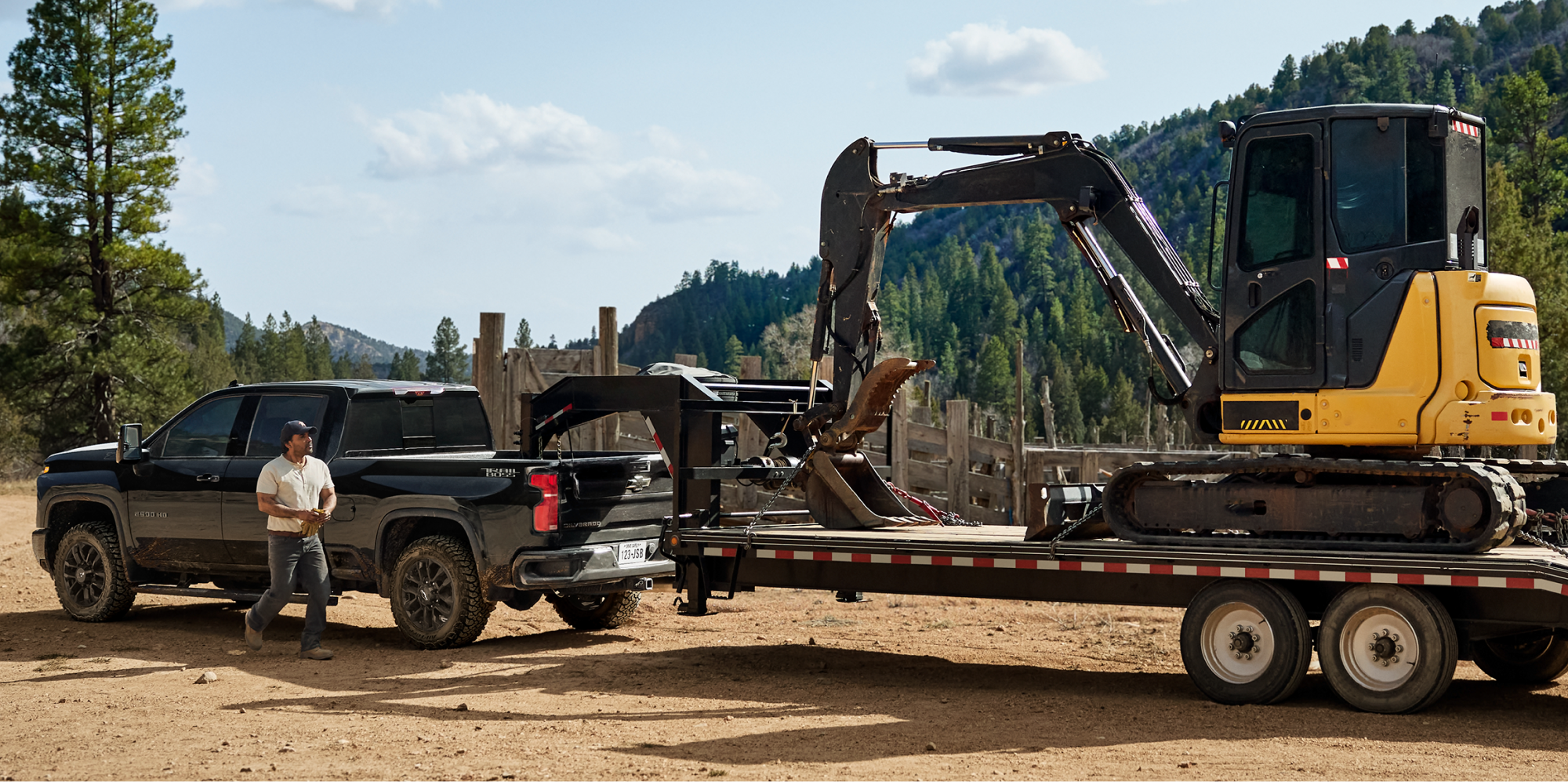 Chevy Trail Boss Truck Towing Construction Heavy Machinery in the Woods