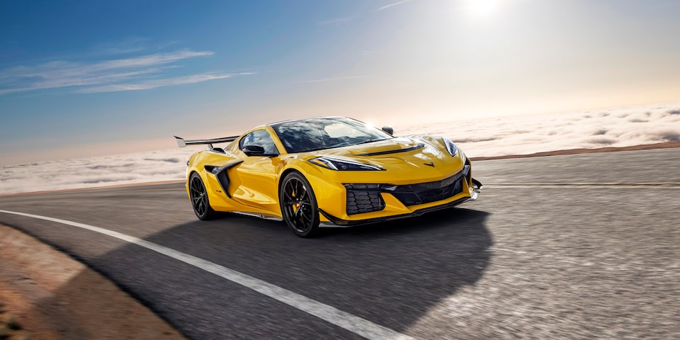 Three Quarter View of a Yellow Chevy Corvette ZR1 Going down a Road on a Sunny Day