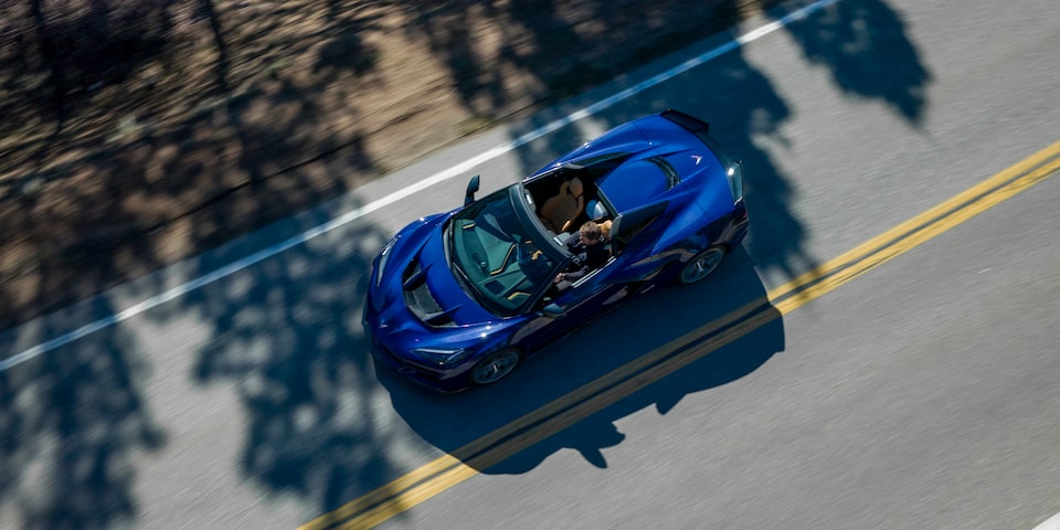 Birds Eye View of a Blue Chevy Corvette ZR1 Driving Down the Road