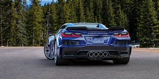 Rear View of a Blue Chevy Corvette ZR1 Surrounded by Trees