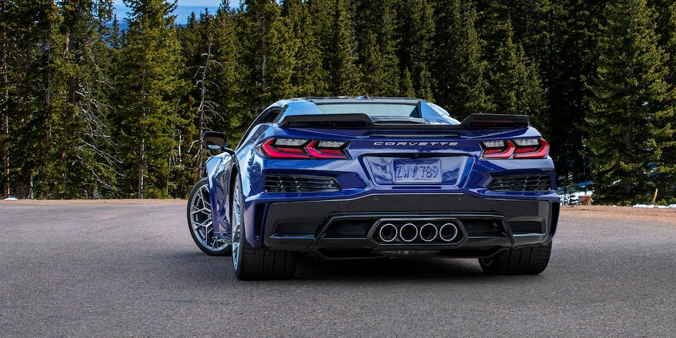 Rear View of a Blue Chevy Corvette ZR1 Surrounded by Trees