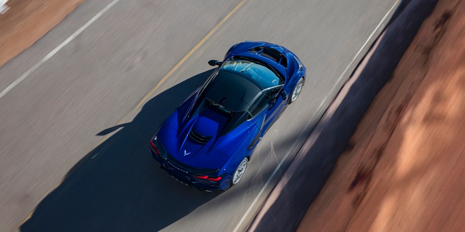 Over Head Shot of a Blue Chevy Corvette ZR1 Driving Down the Road