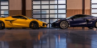 Side View of Two Blue and Yellow Chevy Corvette ZR1 Facing Each Other in a Showroom