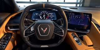 Driver’s Seat View of the Steering Wheel of a Yellow Chevy Corvette ZR1