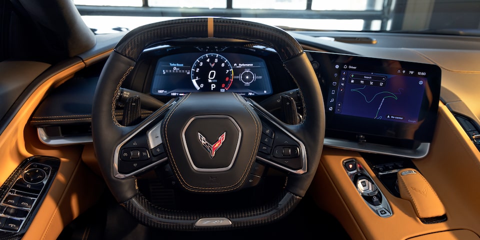 Driver’s Seat View of the Steering Wheel of a Yellow Chevy Corvette ZR1
