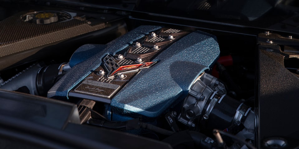 Close-up of the Engine of a Chevy Corvette ZR1 with the Steering Wheel in the Distance