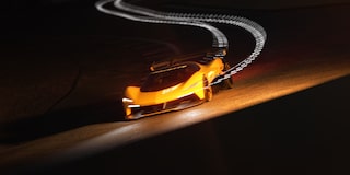 View of the 2026 Corvette CX.R Racing Down a Track at Night
