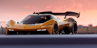 Side View of a Yellow and Black 2026 Corvette CX.R Racing on a Track