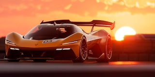 Side View of a Yellow and Black 2026 Corvette CX.R Racing on a Track