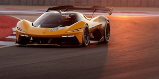 Side View of a Yellow and Black 2026 Corvette CX.R Racing on a Track