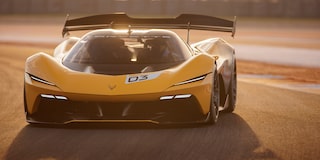 Side View of a Yellow and Black 2026 Corvette CX.R Racing on a Track