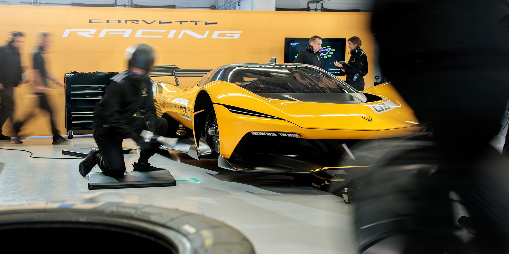 View of a 2026 Corvette CX.R being worked on by a pit crew