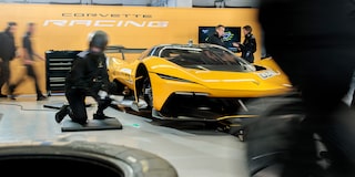 Side View of a Yellow and Black 2026 Corvette CX.R Racing on a Track