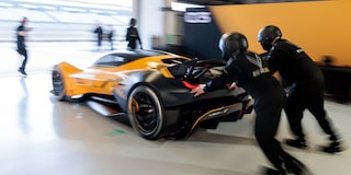 Side View of a Yellow and Black 2026 Corvette CX.R Racing on a Track
