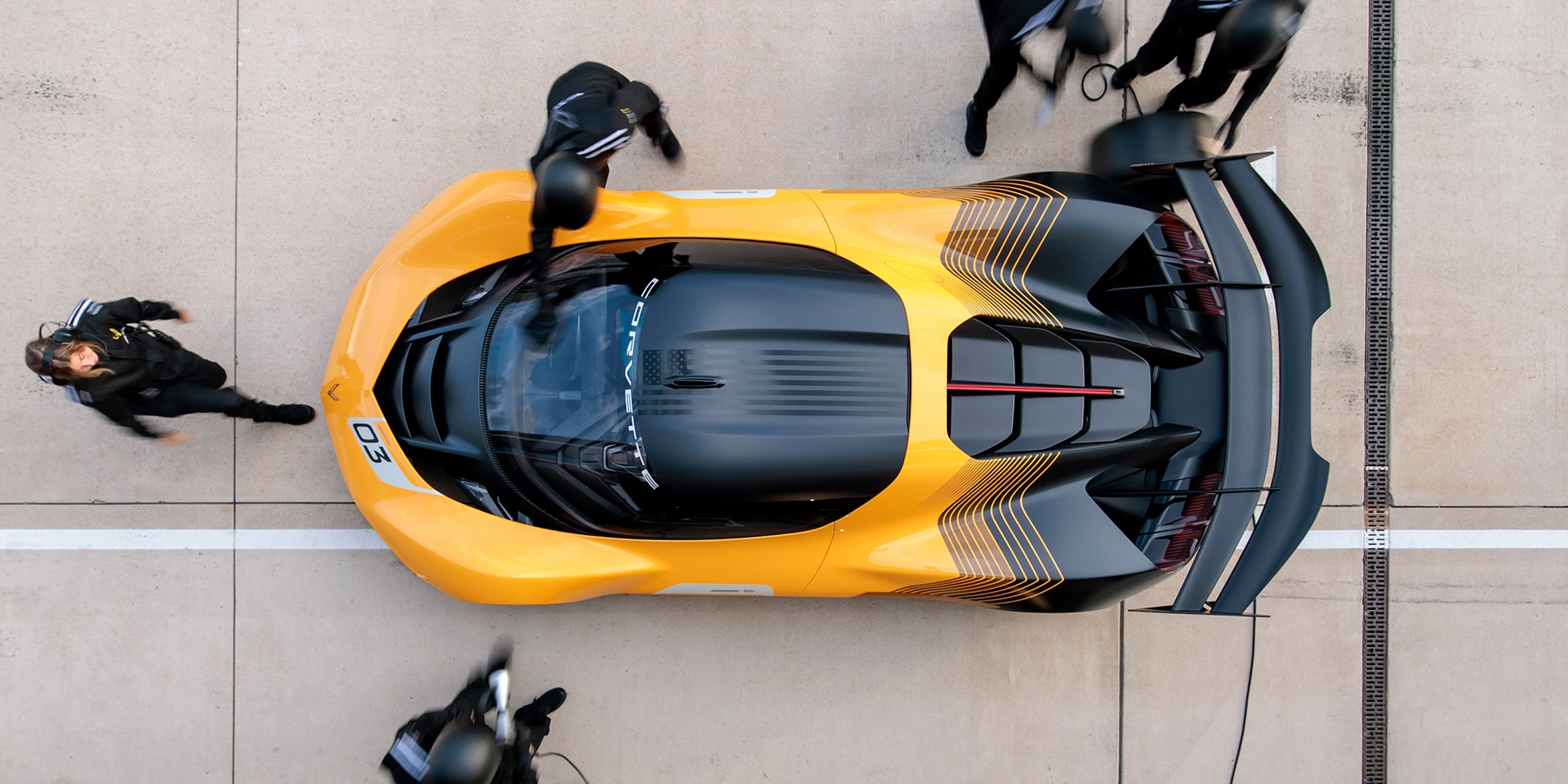 Overhead view of a 2026 Corvette CX.R on a track with a pit crew