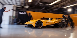 Side View of a Yellow and Black 2026 Corvette CX.R Racing on a Track