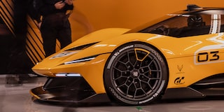 Side View of a Yellow and Black 2026 Corvette CX.R Racing on a Track