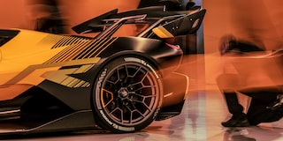 Side View of a Yellow and Black 2026 Corvette CX.R Racing on a Track