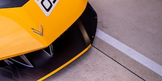 Side View of a Yellow and Black 2026 Corvette CX.R Racing on a Track