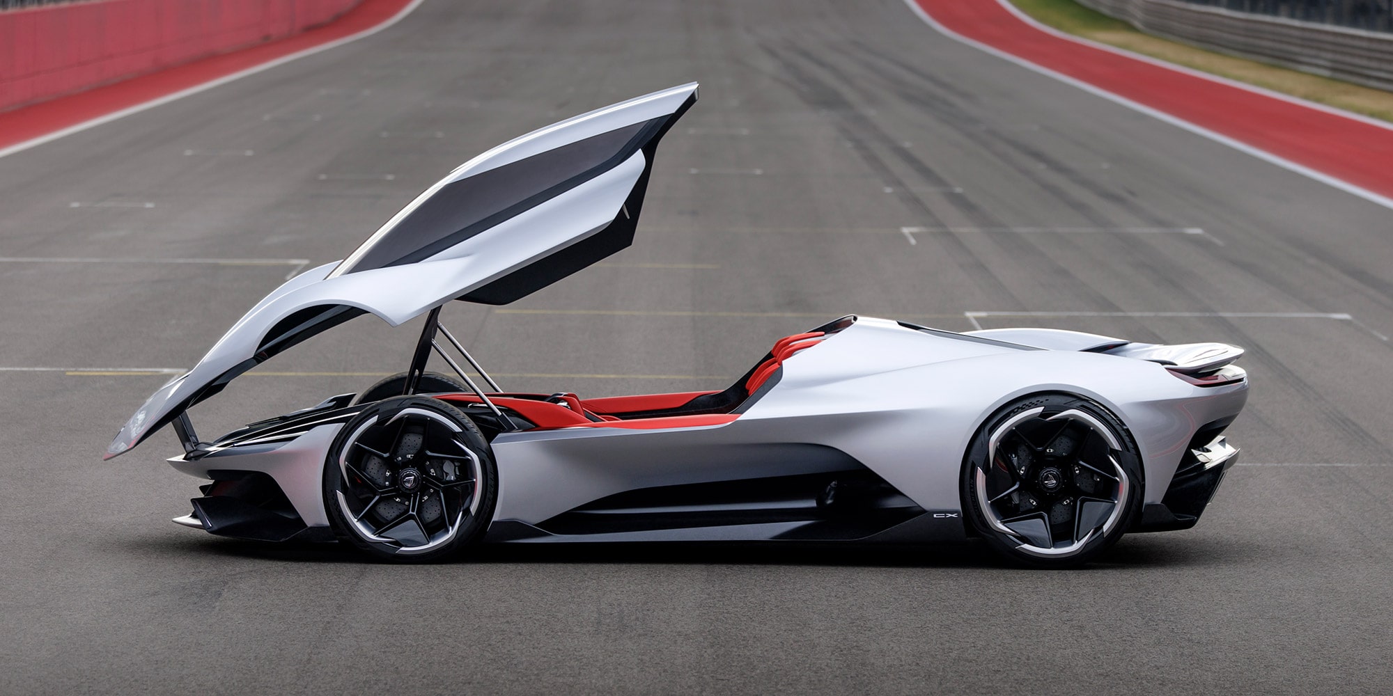 Driver side view of the 2026 Corvette CX with the canopy open