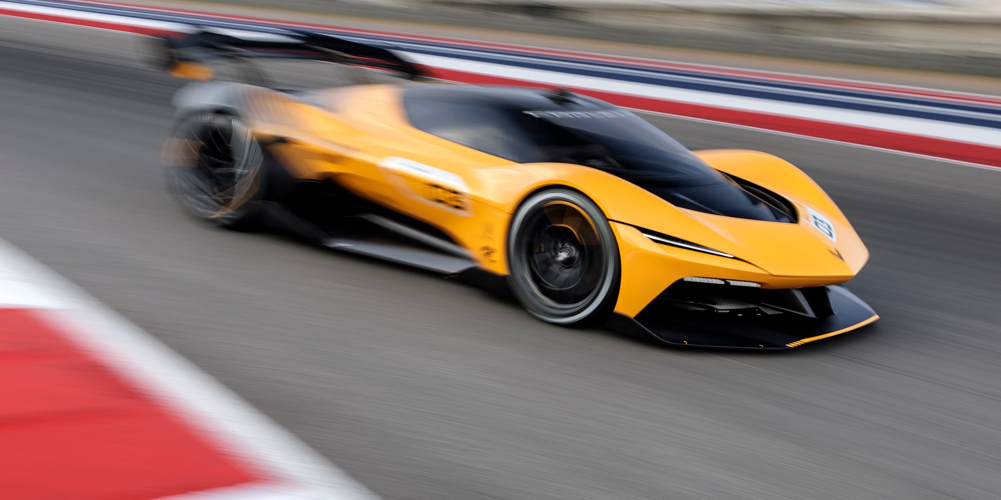 View of the 2026 Corvette CX.R Racing Down a Track at Night