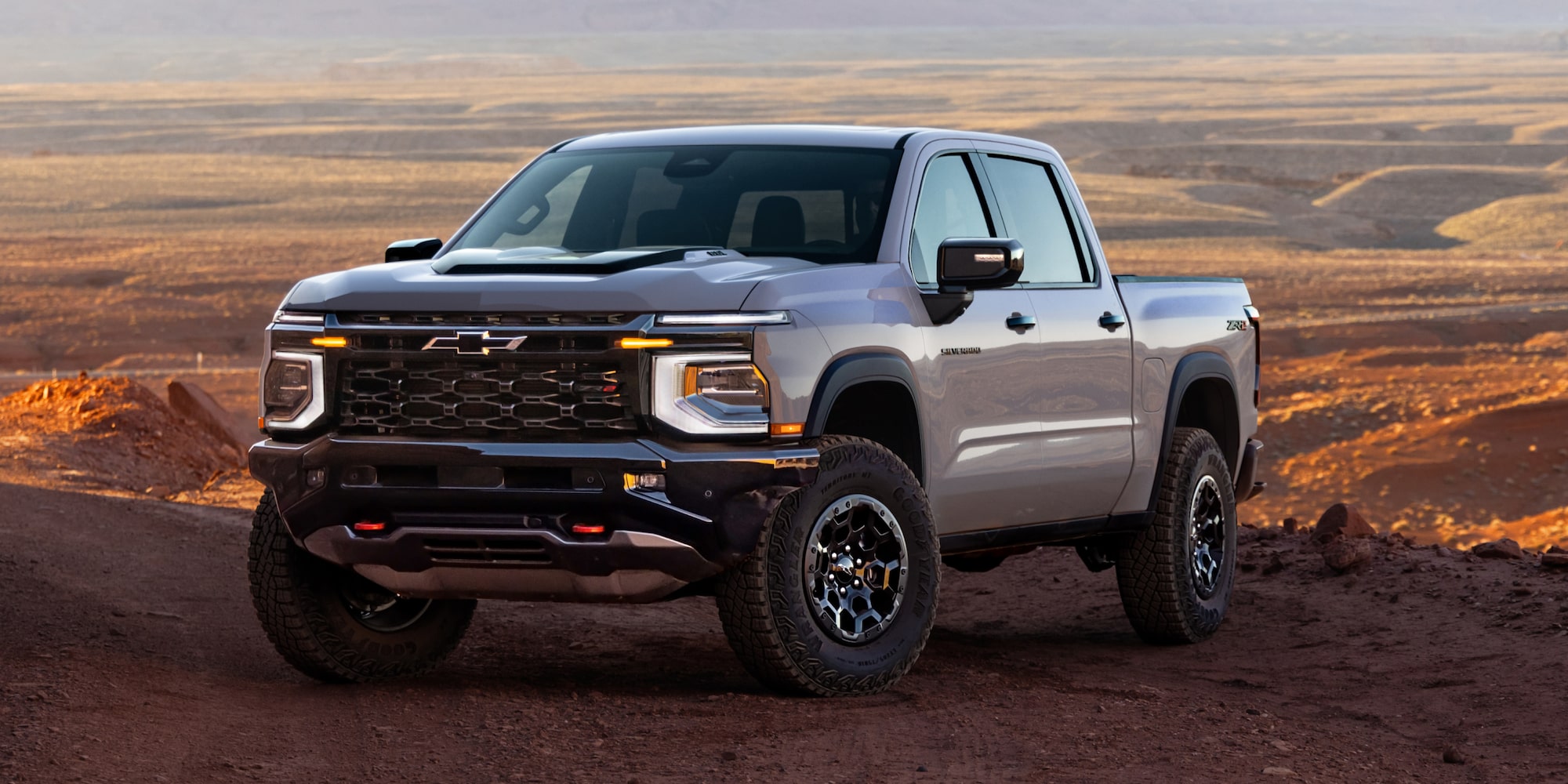 Three-quarters View of a 2027 Chevy Silverado 1500 Parked in an Open Desert