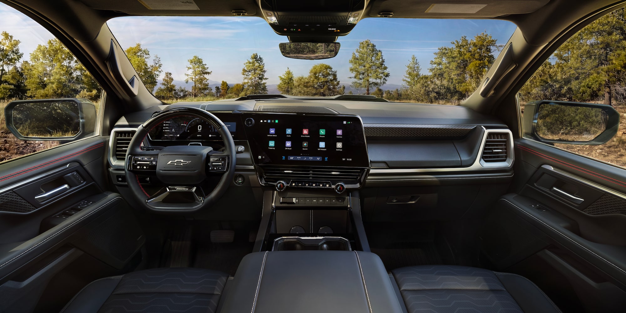 The 2027 Chevy Silverado 1500 Front Row Cabin Interior and Dashboard While Outlooking the Woods