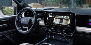 Close-up of the Display Dashboard with the Driver Selecting a Program in a 2026 Chevy Colorado