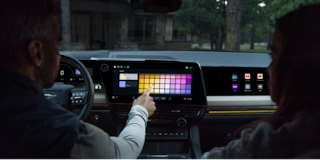 Close-up of the Display Dashboard with the Driver Selecting a Program in a 2026 Chevy Colorado
