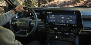 Close-up of the Display Dashboard with the Driver Selecting a Program in a 2026 Chevy Colorado